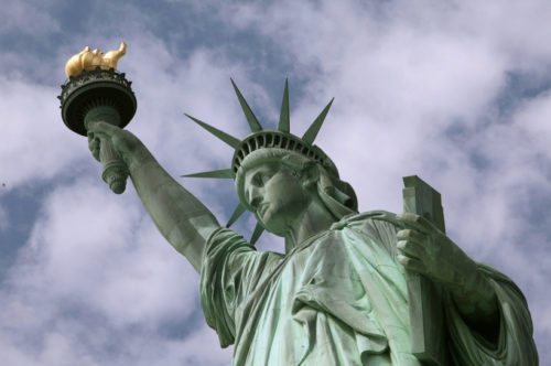 In this June 2, 2009 photo, the Statue of Liberty is seen in New York harbor. The crown is set to open July 4 after being closed since shortly after the Sept. 11, 2001, terrorist attacks. (AP Photo/Richard Drew)